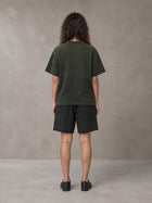 Model wearing the SM Vintage Washed T-shirt and SM Vintage Washed Shorts in Midnight Black, rear view.