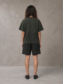 Model wearing the SM Vintage Washed T-shirt and SM Vintage Washed Shorts in Midnight Black, rear view.