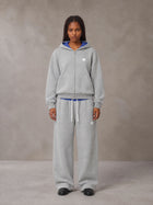 Model wearing the SM Sig. Plaid Zip Hoodie and SM Sig. Plaid Sweatpants in Floral Grey, front view.