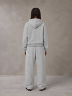Model wearing the SM Sig. Plaid Zip Hoodie and SM Sig. Plaid Sweatpants in Floral Grey, rear view.