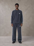 Model wearing the SM Sig. Snow Line Sweatshirt and SM Sig. Snow Line Sweatpants in Oxford Navy, front view.