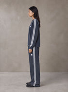 Model wearing the SM Sig. Snow Line Sweatshirt and SM Sig. Snow Line Sweatpants in Oxford Navy, side profile.