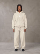 Model wearing the SM Sunfade Fleeced Hoodie and SM Sunfade Fleeced Sweatpants in Camel Tan, front view.
