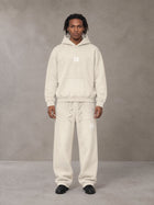 Model wearing the SM Sunfade Fleeced Hoodie and SM Sunfade Fleeced Sweatpants in Camel Tan, front view.