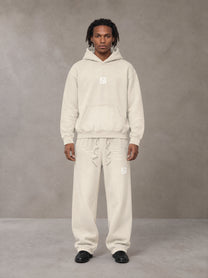 Model wearing the SM Sunfade Fleeced Hoodie and SM Sunfade Fleeced Sweatpants in Camel Tan, front view.
