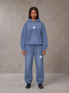 Model wearing the SM Sunfade Fleeced Hoodie and SM Sunfade Fleeced Sweatpants in Deep Denim, front view.