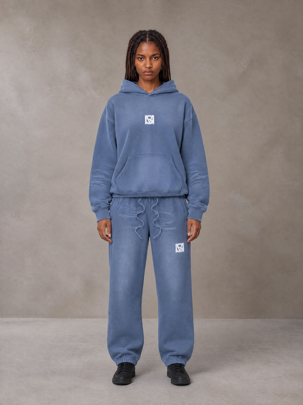 Model wearing the SM Sunfade Fleeced Hoodie and SM Sunfade Fleeced Sweatpants in Deep Denim, front view.