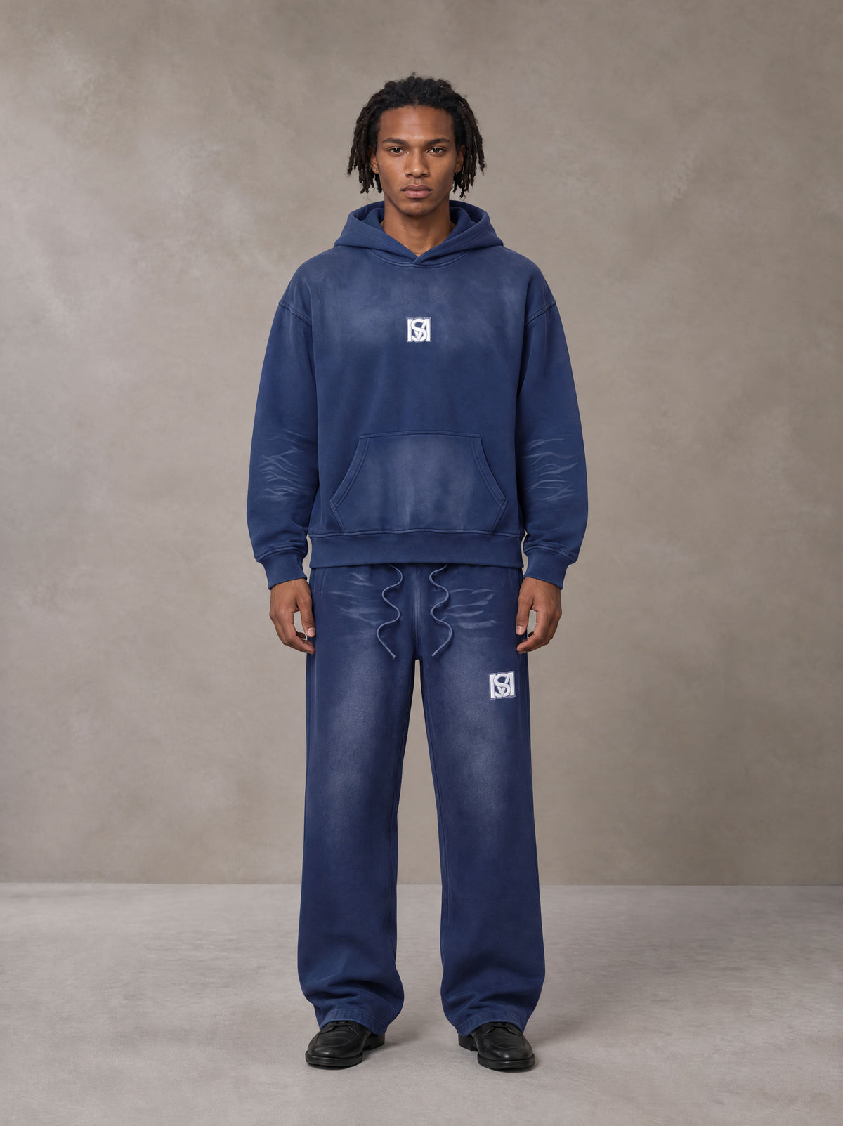 Model wearing the SM Sunfade Fleeced Hoodie and SM Sunfade Fleeced Sweatpants in Oxford Navy, front view.