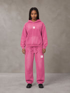 Model wearing the SM Sunfade Fleeced Hoodie and SM Sunfade Fleeced Sweatpants in Vivid Pink, front view.