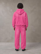 Model wearing the SM Sunfade Fleeced Hoodie and SM Sunfade Fleeced Sweatpants in Vivid Pink, rear view.