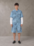 Model wearing the SM Eternal Fleur Mirage Shirt and SM Eternal Fleur Mirage Shorts in Mist, front view.