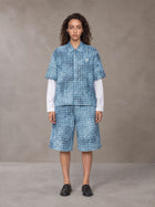 Model wearing the SM Eternal Fleur Mirage Shirt and SM Eternal Fleur Mirage Shorts in Mist, front view.