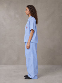 Model wearing the SM The Fabric Of Self Shirt and SM The Fabric Of Self Trousers in Rock Slate Blue, side profile.