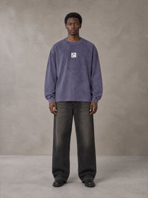 Model wearing the SM Acid Wash Long Sleeve T-shirt in Deep Purple, front view.
