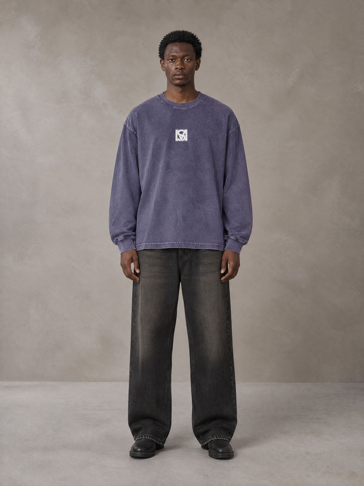 Model wearing the SM Acid Wash Long Sleeve T-shirt in Deep Purple, front view.