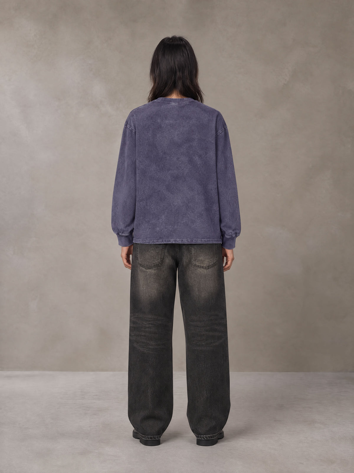 Model wearing the SM Acid Wash Long Sleeve T-shirt in Deep Purple, rear view.