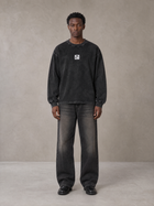 Model wearing the SM Acid Wash Long Sleeve T-shirt in Midnight Black, front view.
