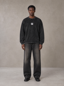 Model wearing the SM Acid Wash Long Sleeve T-shirt in Midnight Black, front view.