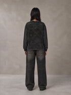 Model wearing the SM Acid Wash Long Sleeve T-shirt in Midnight Black, rear view.