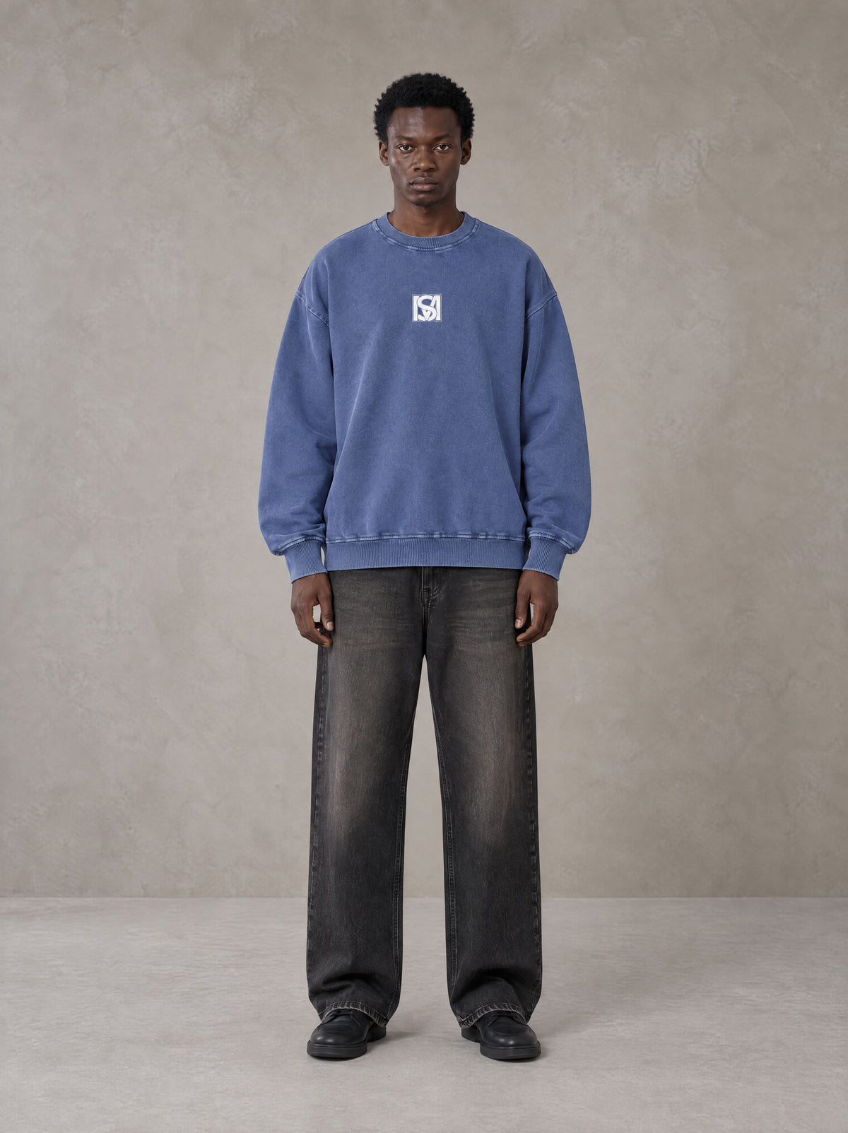 Model wearing the SM Acid Wash Sweatshirt in Classic Blue, front view.