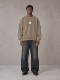 Model wearing the SM Acid Wash Sweatshirt in Coffee Grey, front view.