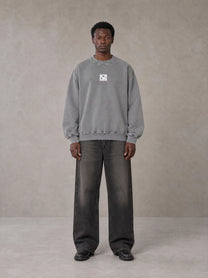 Model wearing the SM Acid Wash Sweatshirt in Pure Grey, front view.