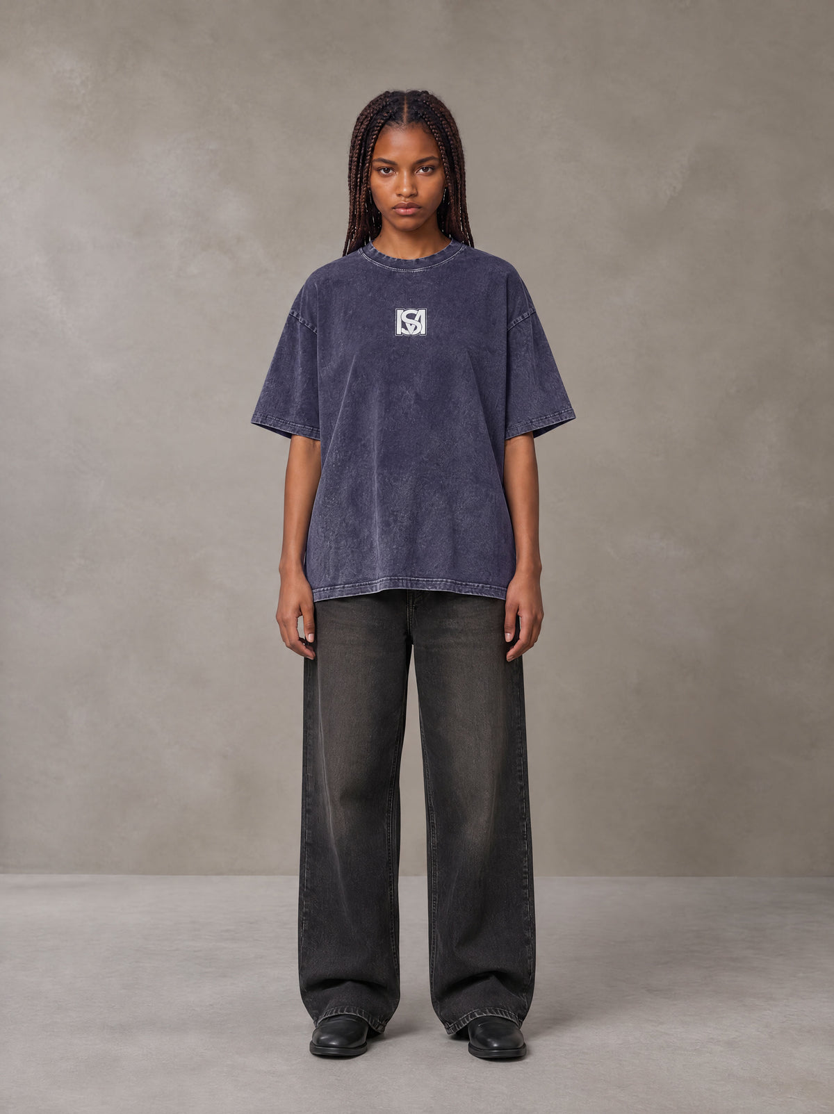 Model wearing the SM Acid Wash T-shirt in Deep Purple, front view.