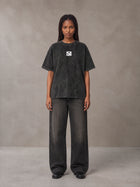 Model wearing the SM Acid Wash T-shirt in Midnight Black, front view.