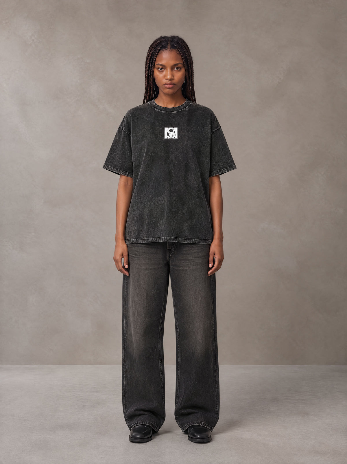 Model wearing the SM Acid Wash T-shirt in Midnight Black, front view.