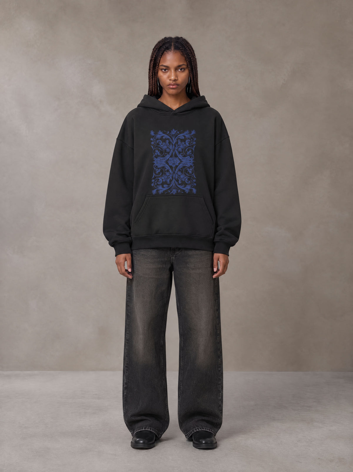Model wearing the SM Baroque Bloom Hoodie in Midnight Black, front view.