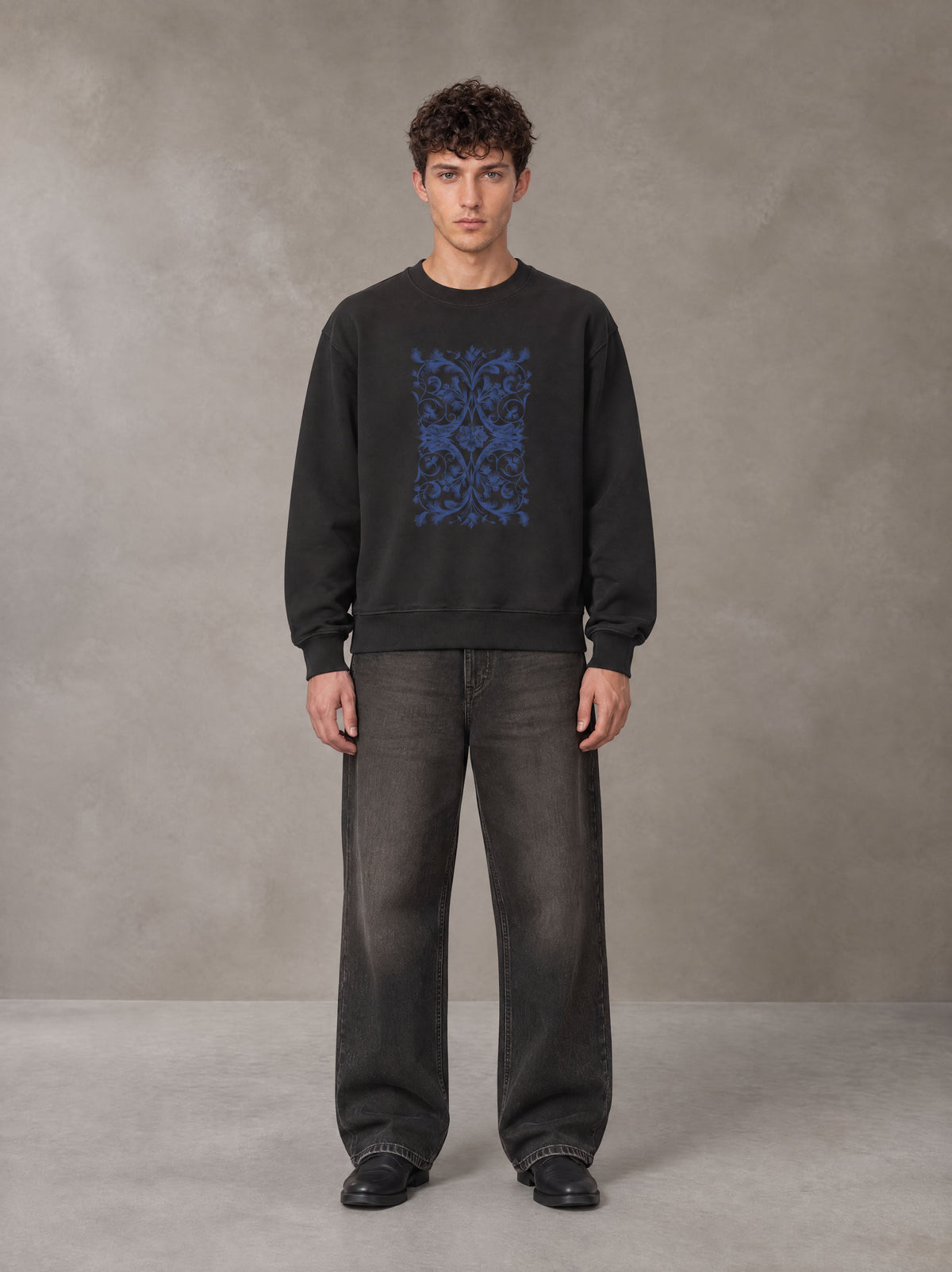 Model wearing the SM Baroque Bloom Sweatshirt in Midnight Black, front view.