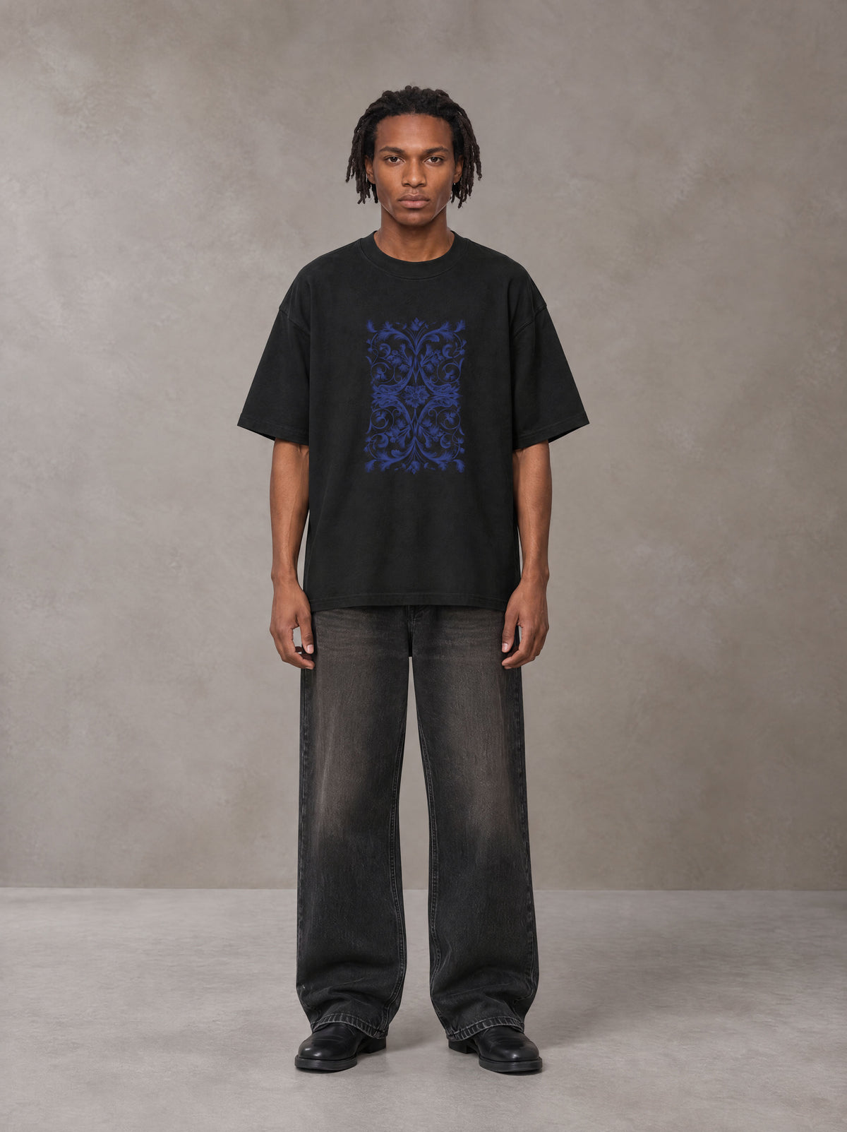 Model wearing the SM Baroque Bloom T-shirt in Midnight Black, front view.