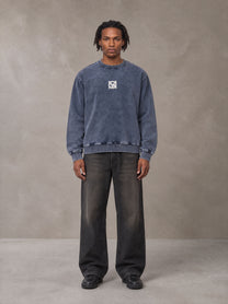 Model wearing the SM Denim Wash Sweatshirt in Oxford Navy, front view.