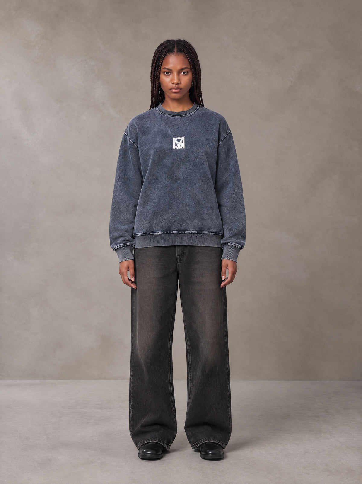 Model wearing the SM Denim Wash Sweatshirt in Oxford Navy, front view.