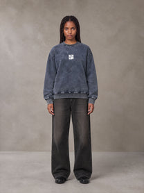 Model wearing the SM Denim Wash Sweatshirt in Oxford Navy, front view.