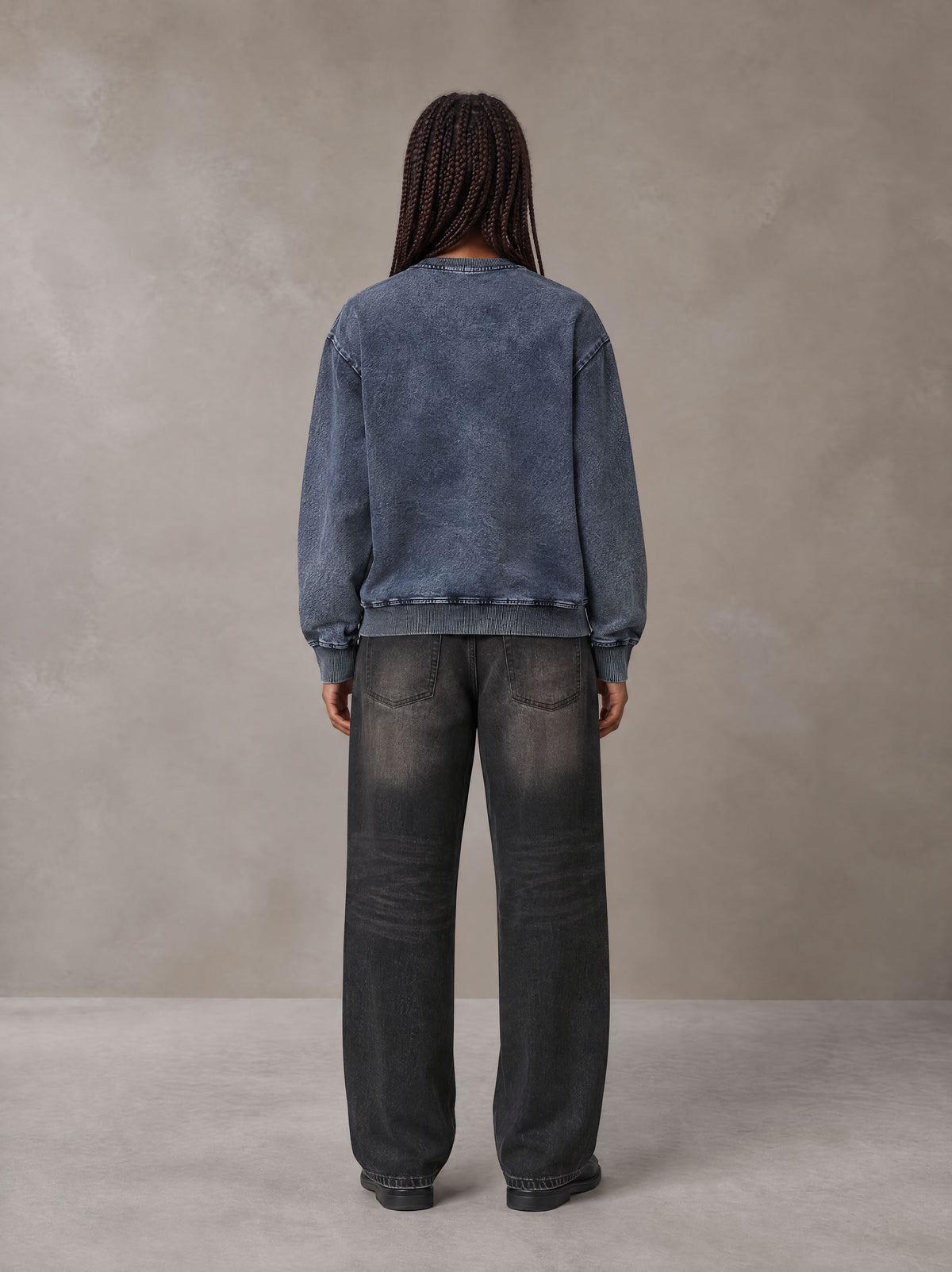 Model wearing the SM Denim Wash Sweatshirt in Oxford Navy, rear view.