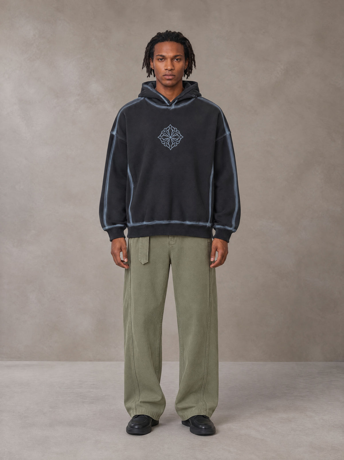 Model wearing the SM Eternal Fleur Belted Trousers in Heritage Khaki, front view.