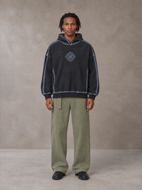 Model wearing the SM Eternal Fleur Belted Trousers in Heritage Khaki, front view.