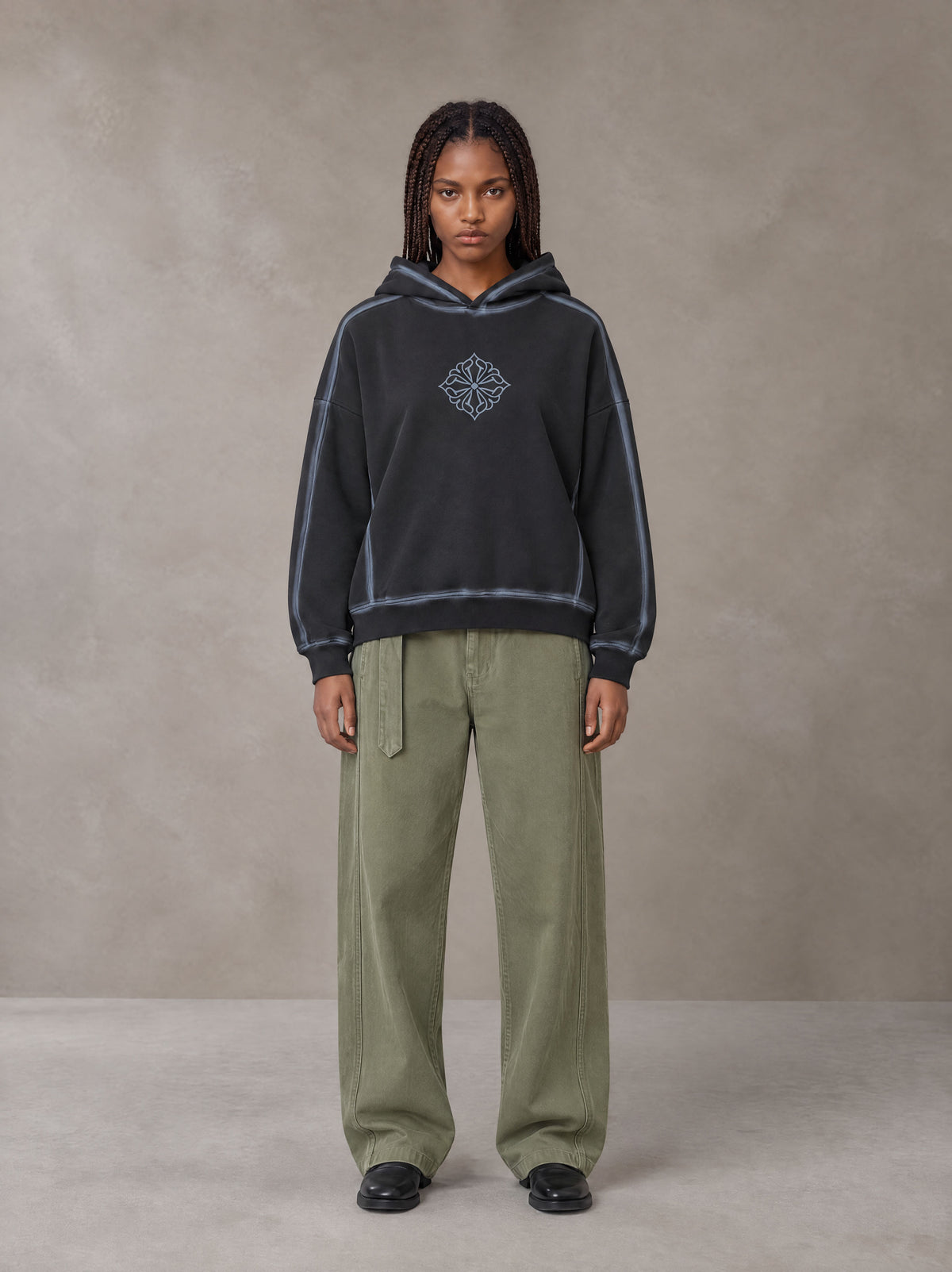 Model wearing the SM Eternal Fleur Belted Trousers in Heritage Khaki, front view.