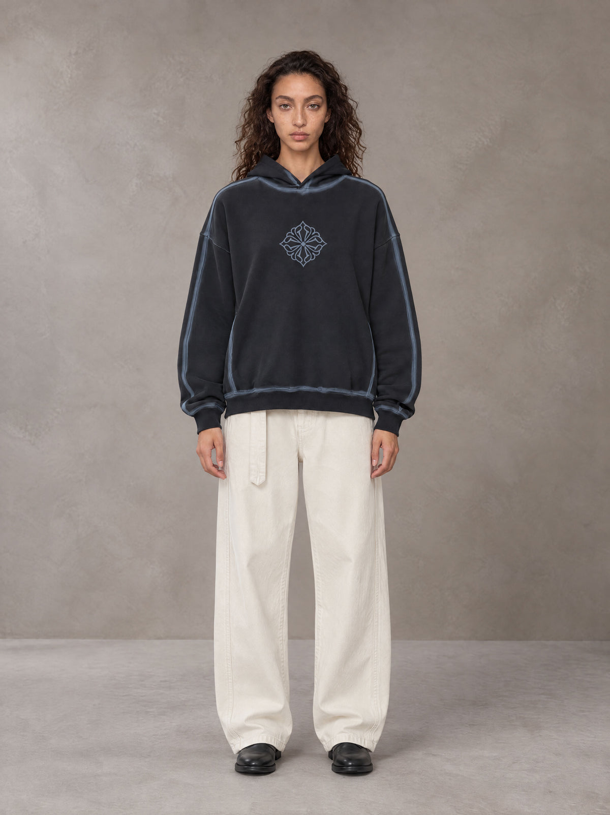 Model wearing the SM Eternal Fleur Belted Trousers in Ivory White, front view.