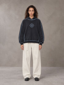 Model wearing the SM Eternal Fleur Belted Trousers in Ivory White, front view.