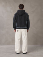 Model wearing the SM Eternal Fleur Belted Trousers in Ivory White, rear view.