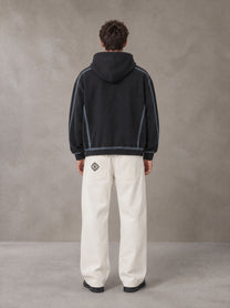 Model wearing the SM Eternal Fleur Belted Trousers in Ivory White, rear view.