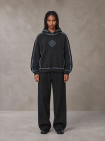 Model wearing the SM Eternal Fleur Belted Trousers in Midnight Black, front view.