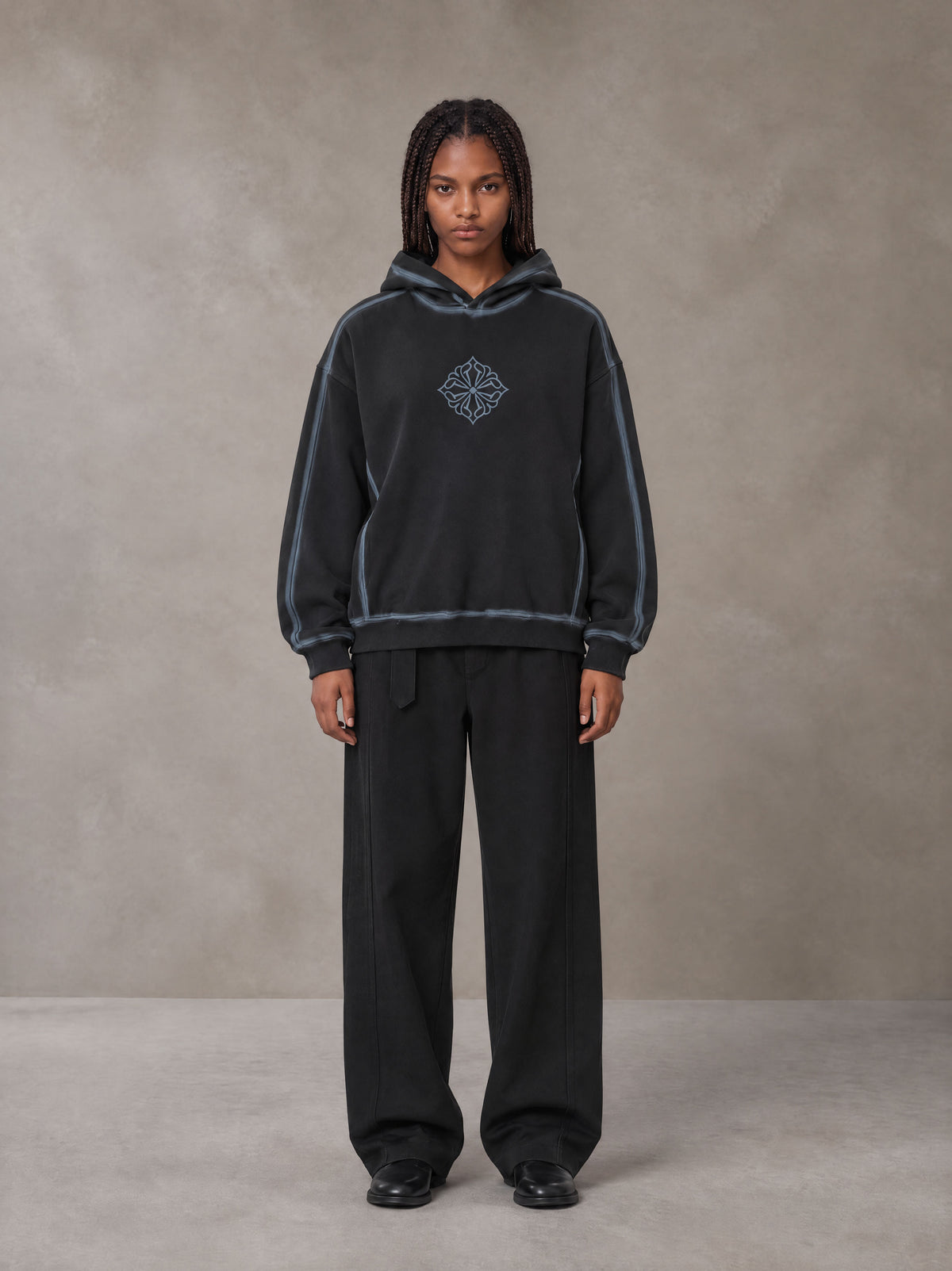 Model wearing the SM Eternal Fleur Belted Trousers in Midnight Black, front view.