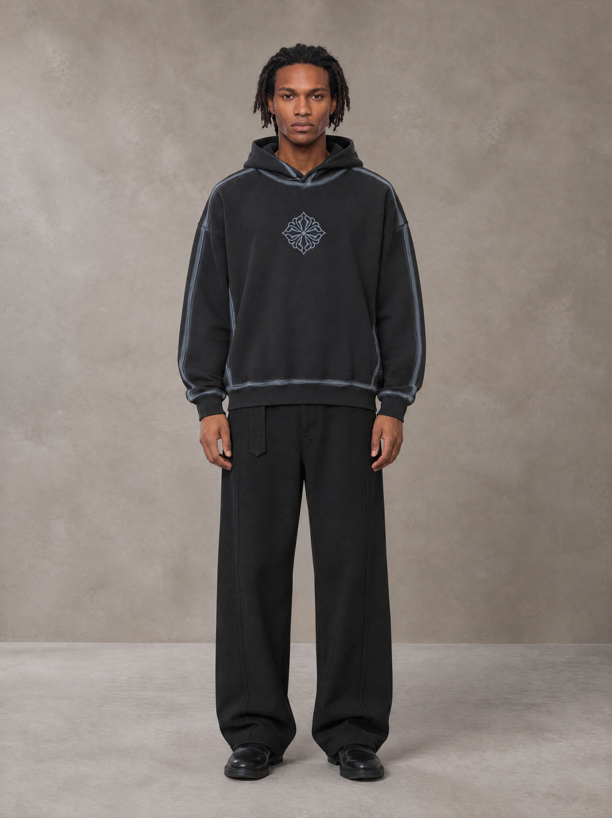 Model wearing the SM Eternal Fleur Belted Trousers in Midnight Black, front view.