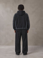 Model wearing the SM Eternal Fleur Belted Trousers in Midnight Black, rear view.