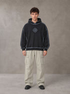 Model wearing the SM Eternal Fleur Cargo Trousers in Stone Grey, front view.