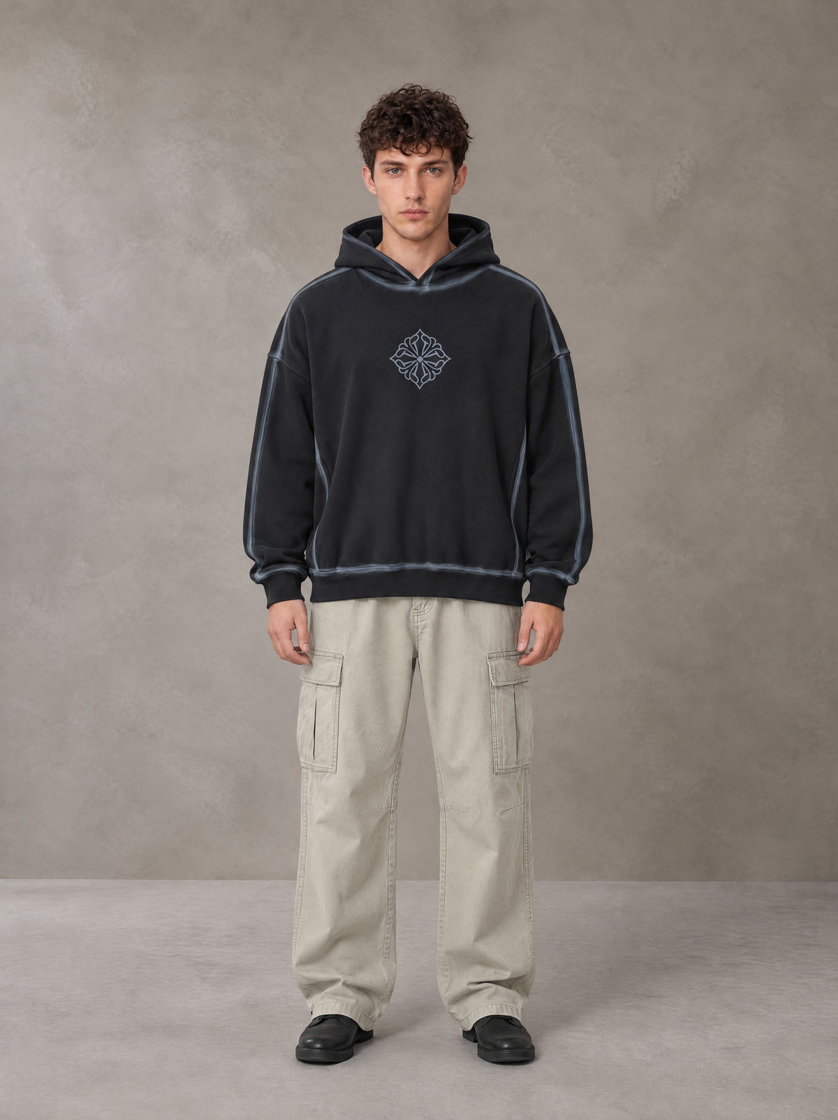 Model wearing the SM Eternal Fleur Cargo Trousers in Stone Grey, front view.