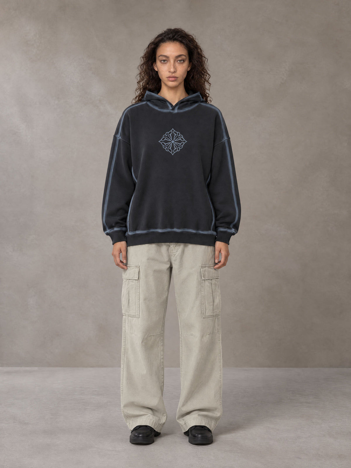 Model wearing the SM Eternal Fleur Cargo Trousers in Stone Grey, front view.